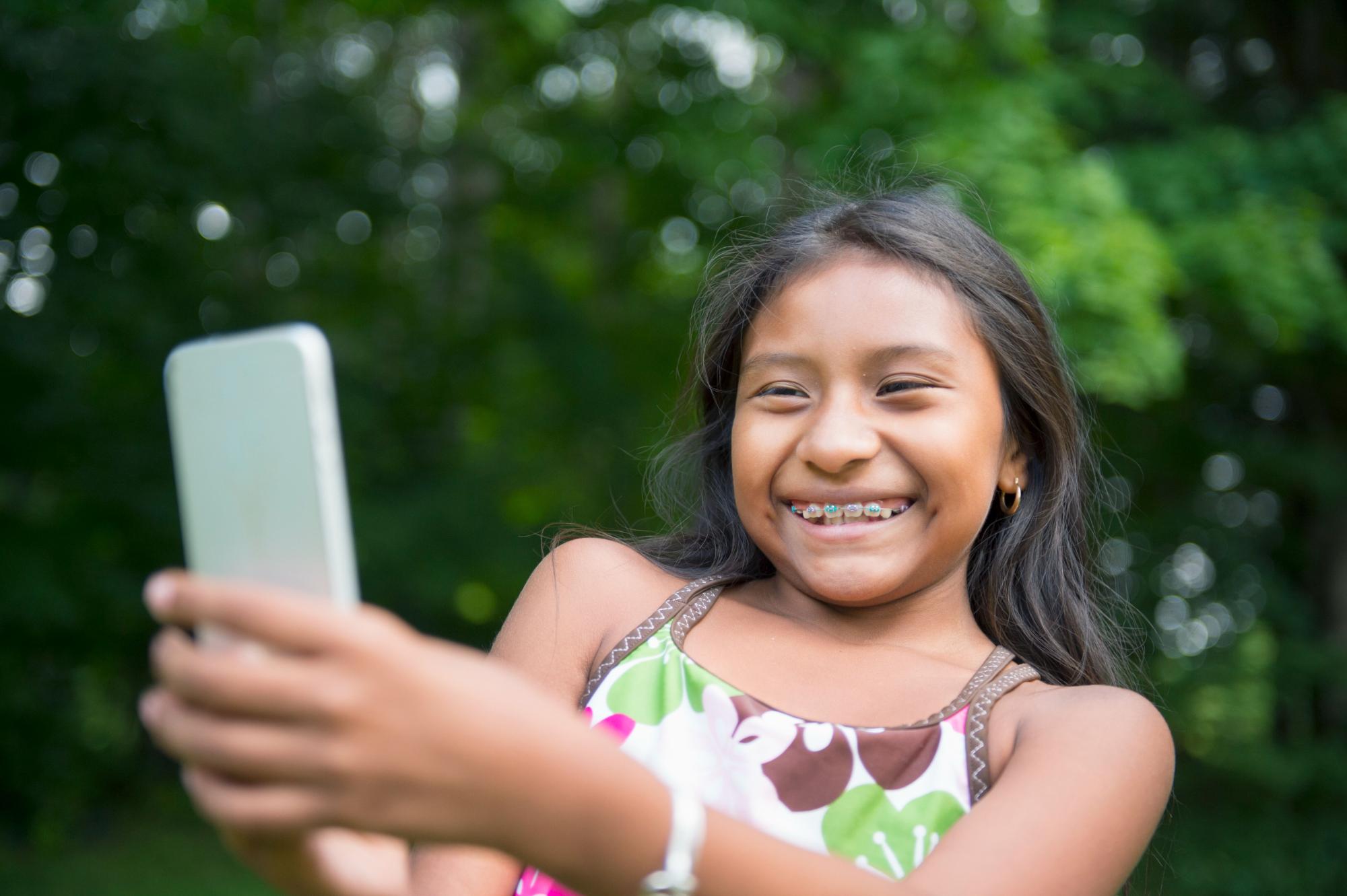 Young girl patient smiling at Sunflower Orthodontics in Mansfield, TX