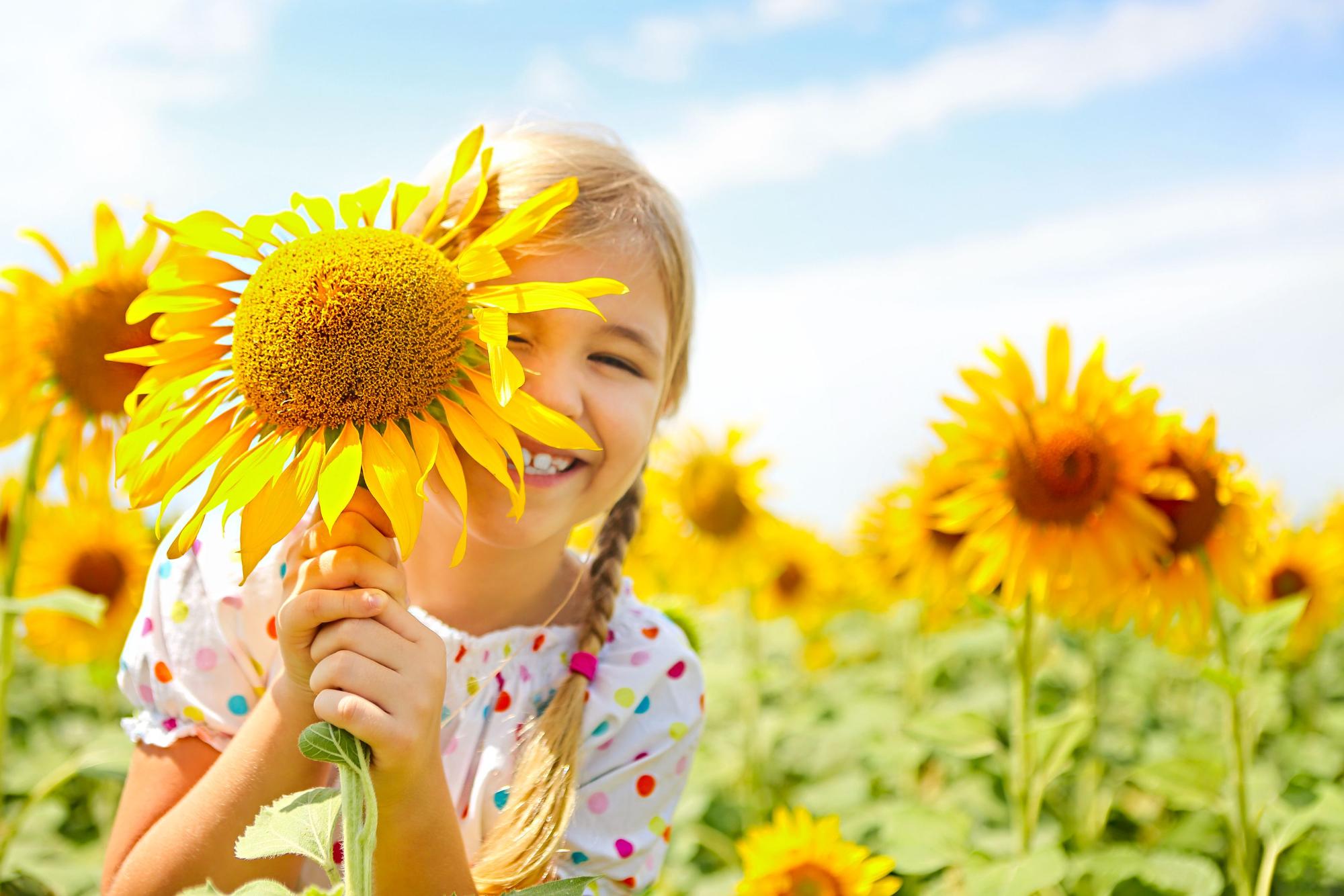 Happy young girl smiling after orthodontic care at Sunflower Orthodontics in Mansfield, TX